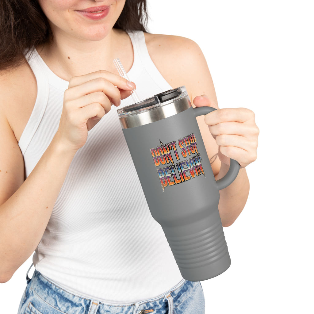 Person holding a gray travel mug with an eagle design and text on a white background