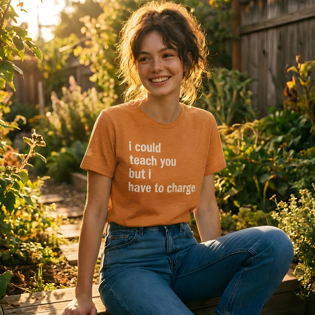 Person wearing an orange shirt with text sitting in a garden, with 'Lyrical Sunshine' logo above.