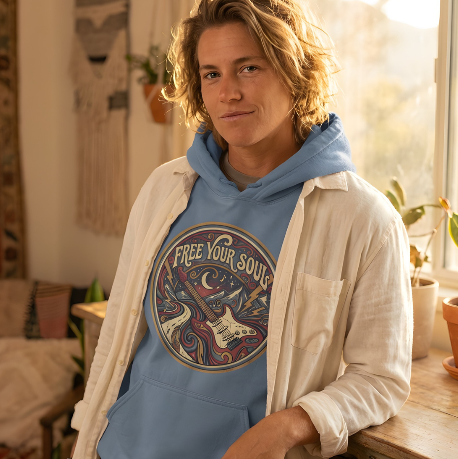 Person wearing a blue hoodie with 'Free Your Soul' text in a cozy room.