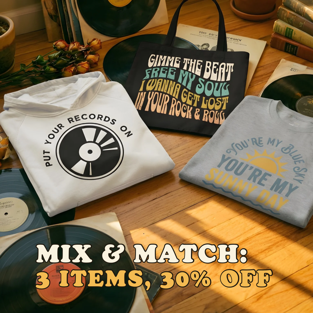 Vinyl records, t-shirts, and a bag on a wooden surface with promotional text overlay.
