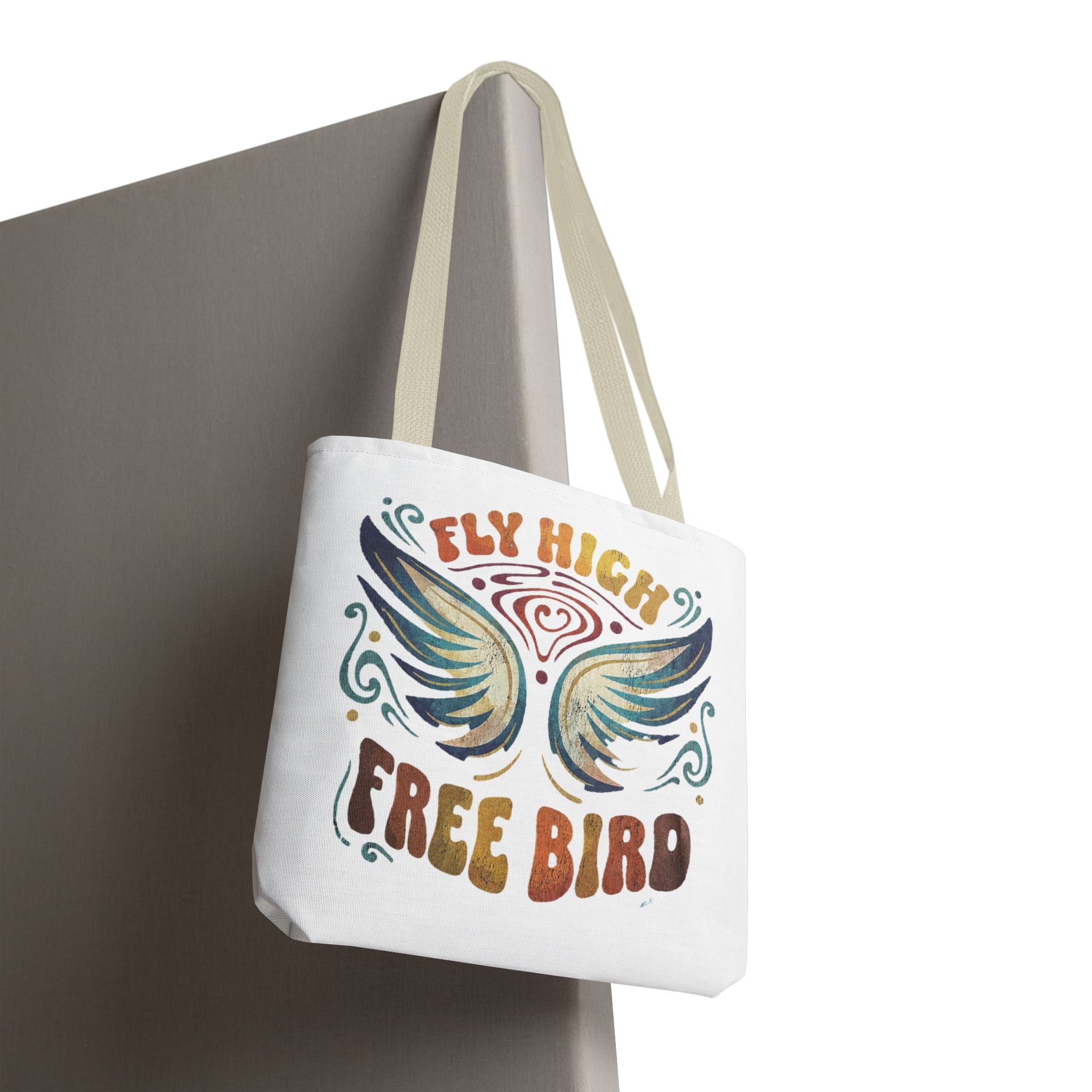 Tote bag with 'Fly High Free Bird' design on a white background