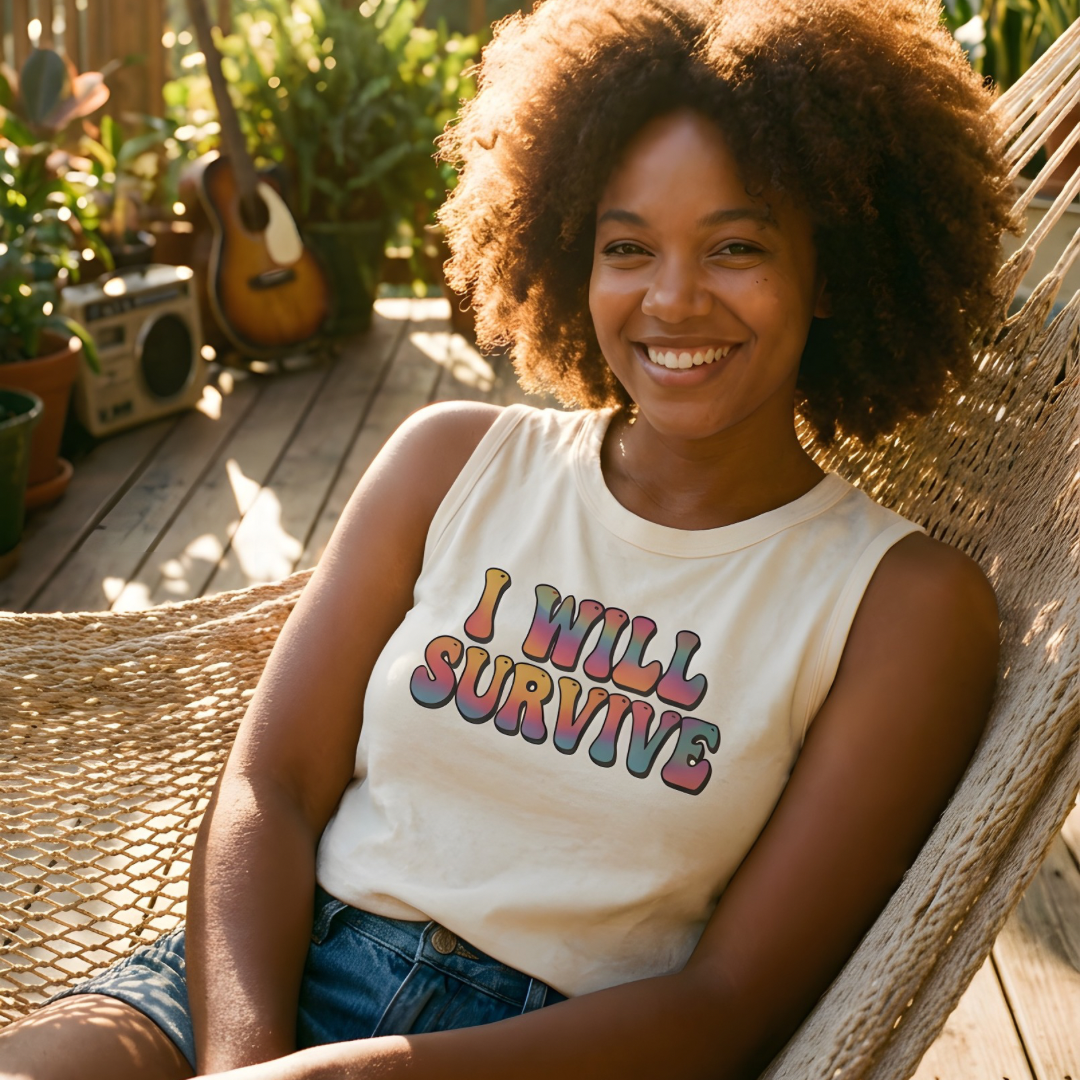Woman sitting in a hammock wearing a 'I Will Survive' shirt on a deck with plants and a guitar in the background.