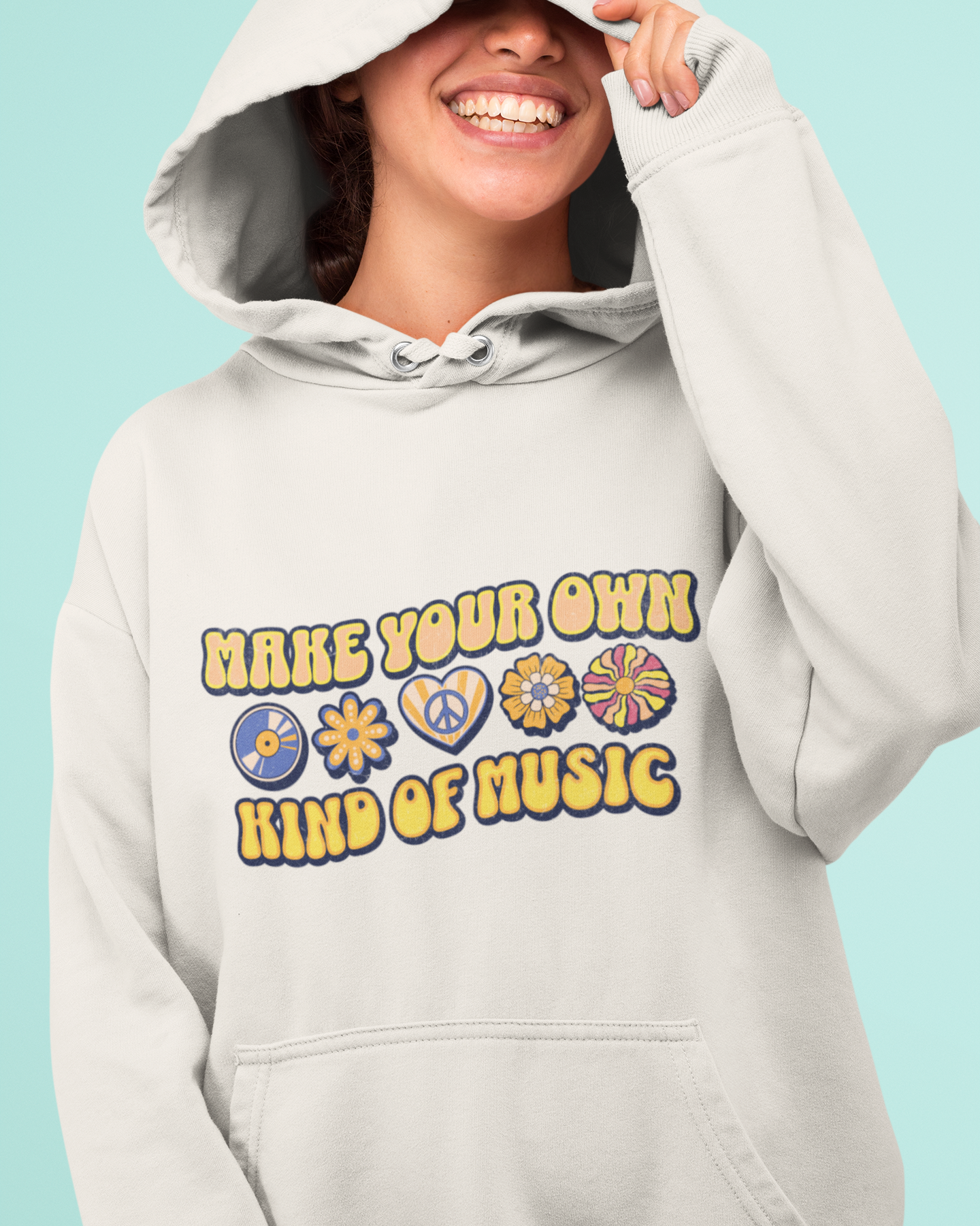 Person wearing a light gray hoodie with a colorful text design on a blue background